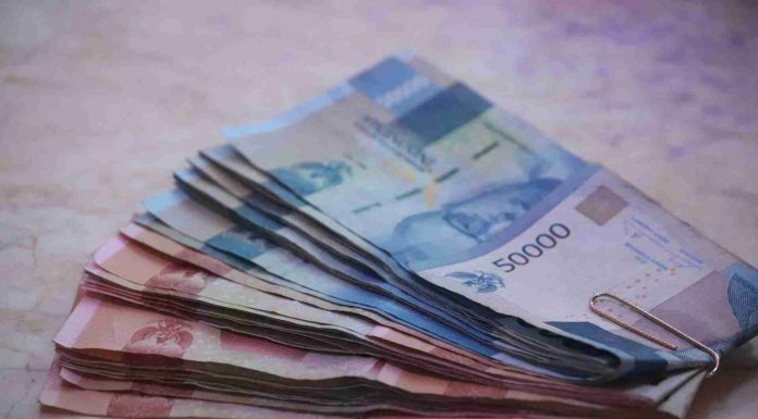 tabur uang di acara 1 Muharram